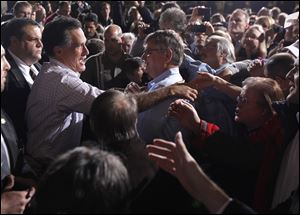 Republican presidential candidate, former Massachusetts Gov. Mitt Romney greets supporters at a town hall meeting in Dayton Saturday. 
