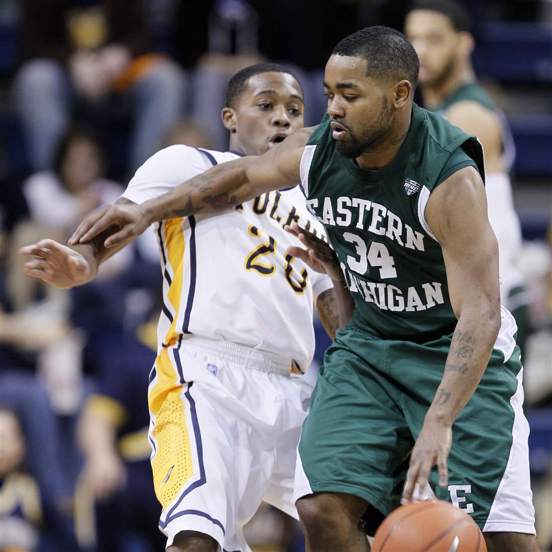 Toledos-Julius-Brown-20-is-pushed-by-Eastern-Michigans-Darrell-Lampley-3