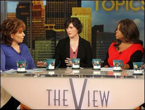 Georgetown University student Sandra Fluke, center, speaks with Joy Behar, left, and Sherri Shepherd, co-hosts of ‘The View,’ about Rush Limbaugh’s comments.