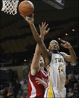 Toledo’s Matt Smith, who had 12 points, goes to the basket against Miami’s Drew McGhee.