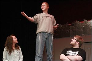 Ann Klewer, left, Andrew English, center, and Andrew Gilson, right, perform a scene during The Clay High School Limelighters rehearsal for the Spring musical which will be the Tony-Award-winning 