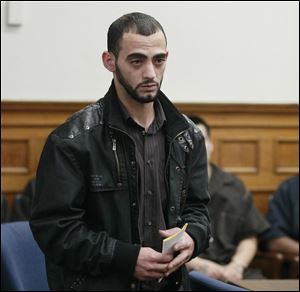 Bandar Abu-Karsh appears Wednesday in Lucas County Common Pleas Court for his arraigned on a voluntary manslaughter charge. He shot and killed a would-be robber while working at a carryout store in North Toledo. 