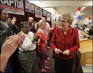 U.S. Rep. Marcy Kaptur celebrates her victory Tuesday at the Laborers Local 500 Hall in Toledo. A fact-checking operation deemed two of her ads 'half-true' and one 'false.'