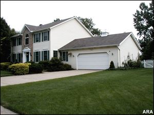 The same home before a new garage door.