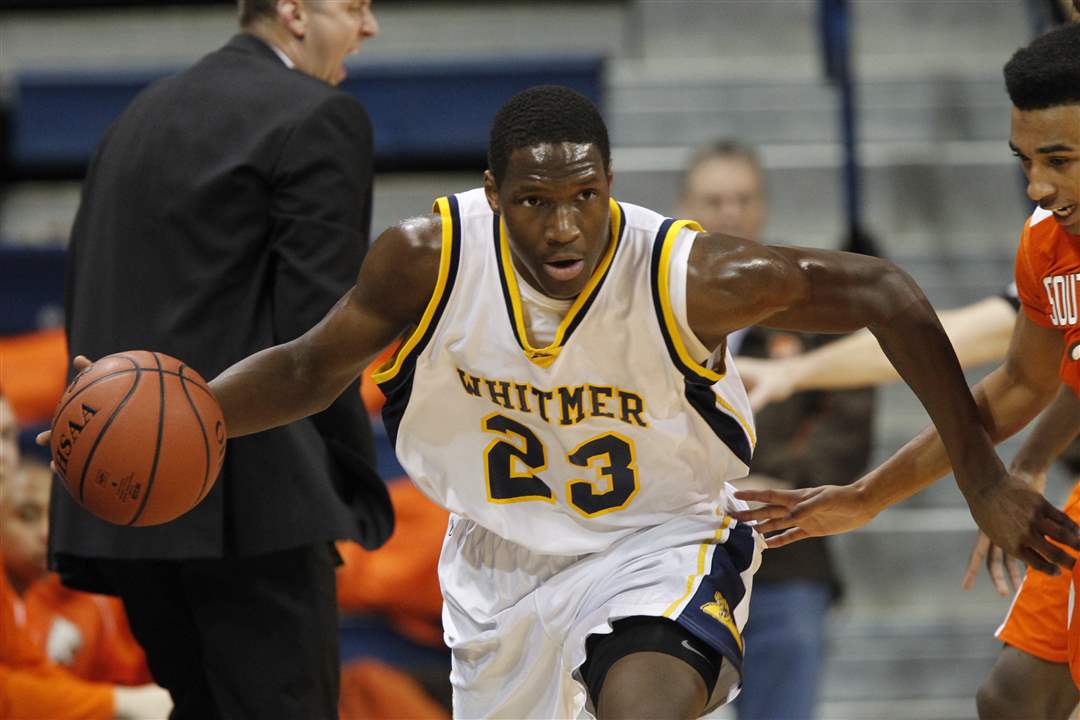 Whitmer-High-School-player-Nigel-Hayes-23-brings-the-ball-past-Sylvania-Southview-player-Me-Gail-Frisch-14