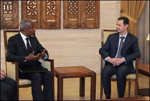 Syrian President Bashar Assad, right, meets with Kofi Annan, the United Nations special envoy to Syria, in Damascus, Syria, Saturday.