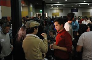 Ben Silbermann, center, of Pinterest, mixes with the crowd for questions in Palo Alto, Calif. Mr. Silbermann credits his wife for pushing him to tackle the startup he'd been talking about.