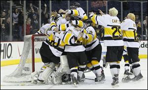 Northview players celebrate the school’s first state championship of any kind after beating Lakewood St. Edward Sunday afternoon. 