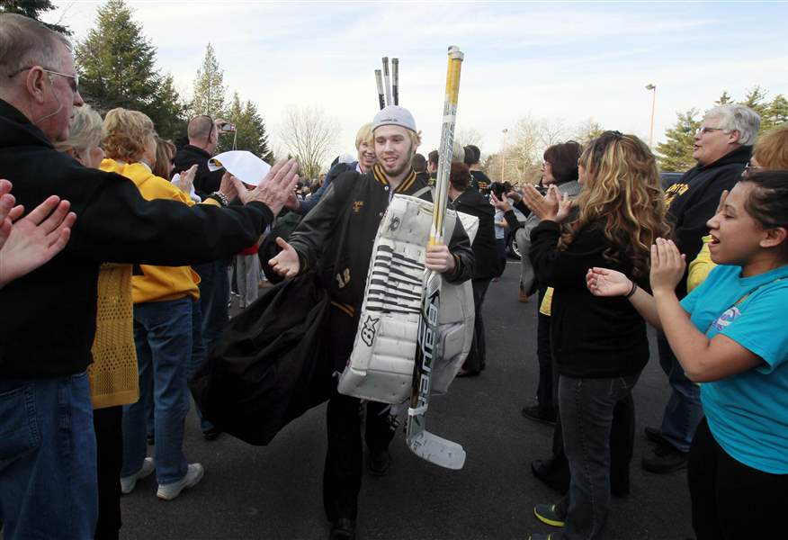 Austin-Gryca-leads-his-team-through-tunnel-of-fans