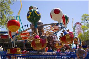 Traditional rides such as this that draw customers during the day will be supplemented with a nighttime show that includes laser lights.