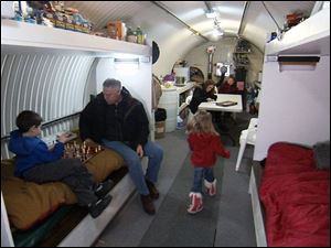Peter Larson and his family relax in their underground bunker, which they use as a weekend getaway.