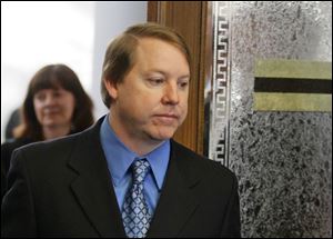 Former Waterville Township police officer David Krego enters Lucas County Common Pleas Court in Toledo.