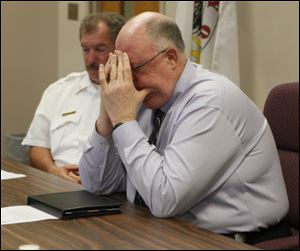 Wauseon Schools Superintendent Marc Robinson listens with Fire Chief Marvin Wheeler during a press conference regarding the shooting death of seventh grader Michael Schwartz, 13, who was shot in the chest and killed.