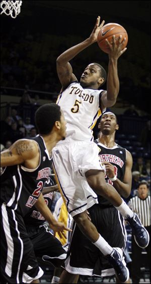 University of Toledo guard Rian Pearson (5) goes to the net against  Northern Illinois during a January game at Savage Arena.