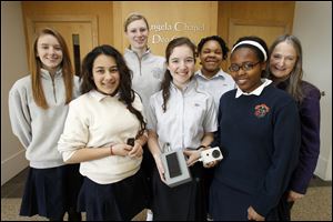 The St. Ursula team consists of, in back row, from left, Elizabeth Hertz, Madeline Meads, Charese Foster, and instructor Jackie Kane, and in the front row, from left, Neera Martin, Beatrice Thaman, and Nicole Ishimwe.
