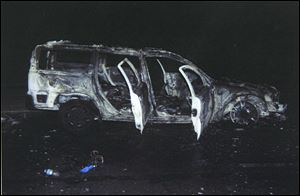 Erik Chappell's car was blasted Sept. 20 on East Elm Street in Monroe near I-475. He escaped the vehicle with his sons, Grant and Cole. 
