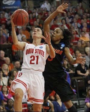 Ohio State's Samantha Prahalis drives to the basket while being guarded by Florida's Lanita Bartley in the first round of the 2012 NCAA Women's basketball tournament at Bowling Green State University.