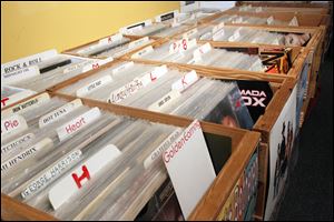 A collection of albums for sale in crates in Amjad Doumani's  storefront shop.