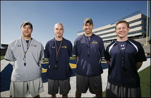 New Rockets head football coach Matt Campbell, third from left, has hired former Mount Union assistant coaches Tom Manning, left Stan Watson, and Jason Candle. 



