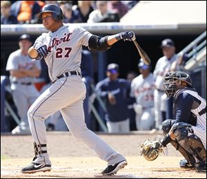 Detroit's Jhonny Peralta hits a single to score a run in the second inning Wednesday against the Mud Hens at Fifth Third Field.