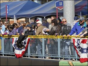 Fans take advantage of the warm sunshine at Fifth Third Field.