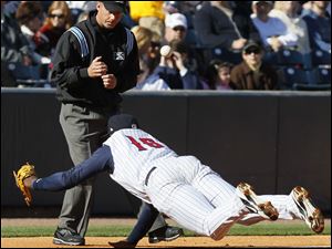 Mud Hens third baseman Audy Ciriaco (16) dives for a ball and misses against Indianapolis.