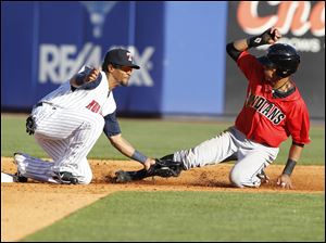 Toledo's Eric Patterson (3) tags out  Indianapolis player Gorkys Hernandez (7) as he tries to steal second in the sixth inning.