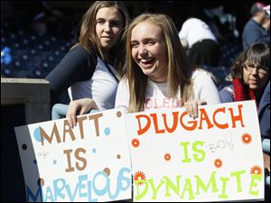 Mud Hens fans Leslie Zazula, 13, of Plymouth, Mich., and her sister Emily Zazula, 21, in back, show their support.