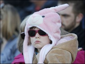 Mud Hens fan Allison Bailey, 6, sports an Easter bunny hat as she sits with her mother Ann Bailey, of Holland, and watches the Toledo play the Indianapolis Indians.