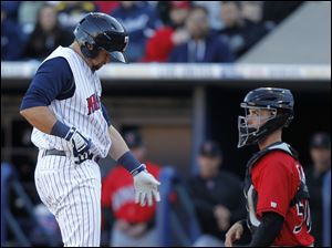Toledo player Jerad Head, 13, drops his bat as he's hit in the hand by a pitch in the sixth inning.