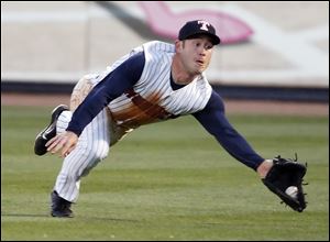Toledo right fielder Matt Young (6) makes a diving catch  against Louisville during the sixth inning.