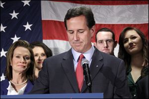 Surrounded by members of his family Republican presidential candidate, former Pennsylvania Sen. Rick Santorum announces he is suspending his candidacy effective today in Gettysburg, Pa., Tuesday.