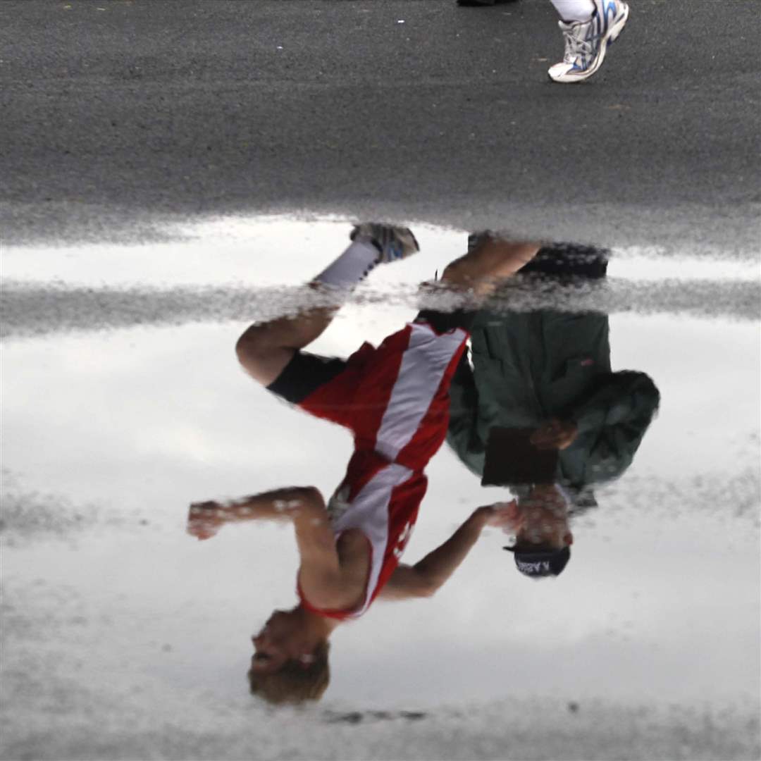 Ayersville-resident-David-Welty-calls-the-names-of-high-jumpers