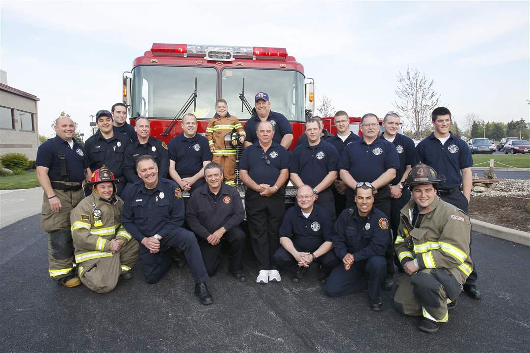 Perrysburg-Township-firefighters-and-Hunter-Bute-center-rear-in-his-Perrysburg-Township