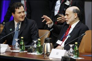 Federal Reserve Chairman Ben Bernanke, right, talks with British Chancellor of the Exchequer George Osborne during a G-20 finance ministers and central bank governors meeting, Friday, April 20, 2012, at the IMF and World Bank Group Spring Meetings in Washington.