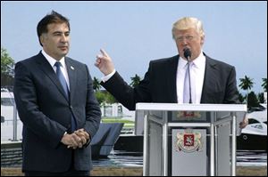 U.S. business magnate Donald Trump, right, gestures as Georgian President Mikhail Saakashvili, left, looks on in Batumi, Georgia, on Sunday. 