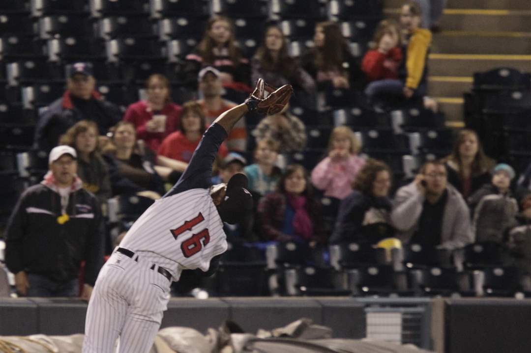 Audy-Ciriaco-in-unable-to-catch-a-fly-ball-hit-by-Gwinnett-s-Joey-Terdoslavich