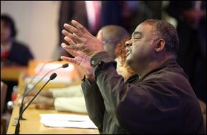 Al Garrett, president of the AFCSME, addresses city council about union contracts at an April 2 meeting.