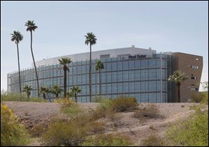 First Solar Inc's corporate headquarters in Tempe, Ariz. First Solar Inc will lay off 2,000 workers and close it's factory in Germany following a collapse in solar panel prices.