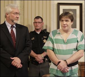 Kenneth Richey, with his attorney, Gregory Meyers, says
the New Year’s Eve telephone call was a drunken prank.