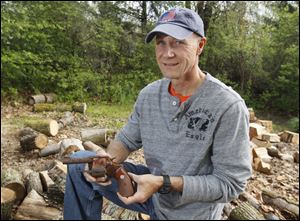 Former police Sgt. Mark Hearndon holds the gun he lost during the Blizzard of 1978. The weapon was found three months later. He was given the gun as a souvenir. He retired April 27, and while he plans to spend more time with his family, he wants to lead mission trips to Honduras.