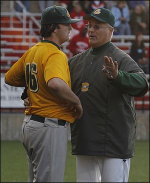 Clay assistant coach Rod Achter talks to pitcher Jordan Grosjean, who struck out14 batters.