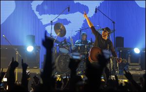 Eric Church and his band perform in front of a rowdy crowd at the Huntington Center Thursday night.