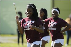Diamond Adams, 15, dances with the Scott High School band during the rally, organized to show young people in a more positive light.