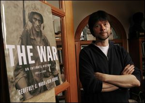 Documentary filmmaker Ken Burns poses at his office.