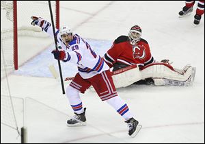 The Rangers' Chris Kreider celebrates his goal in front of  the Devil's Martin Brodeur in Saturday's 3-0 Game 3 win.