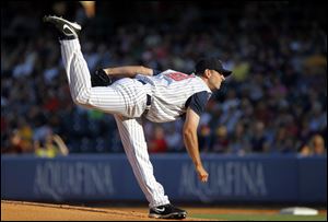 The Mud Hens' Jacob Turner fires in a pitch during the first inning against the Syracuse Chiefs at Fifth Third Field on Saturday. The Hens pitcher gave up four earned run in six innings pitched, striking out six and walking two in Toledo's 8-5 loss.