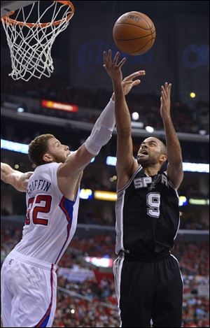 San Antonio's Tony Parker puts up a shot against Los Angeles' Blake Griffin.
