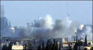 This image made from amateur video released by Shaam News Network and accessed Friday purports to show shelling in Jobar, Syria.