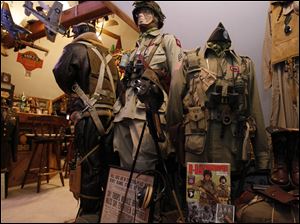 Paratroopers uniforms in Mike McMahon's collection of military items on the third floor of his home.